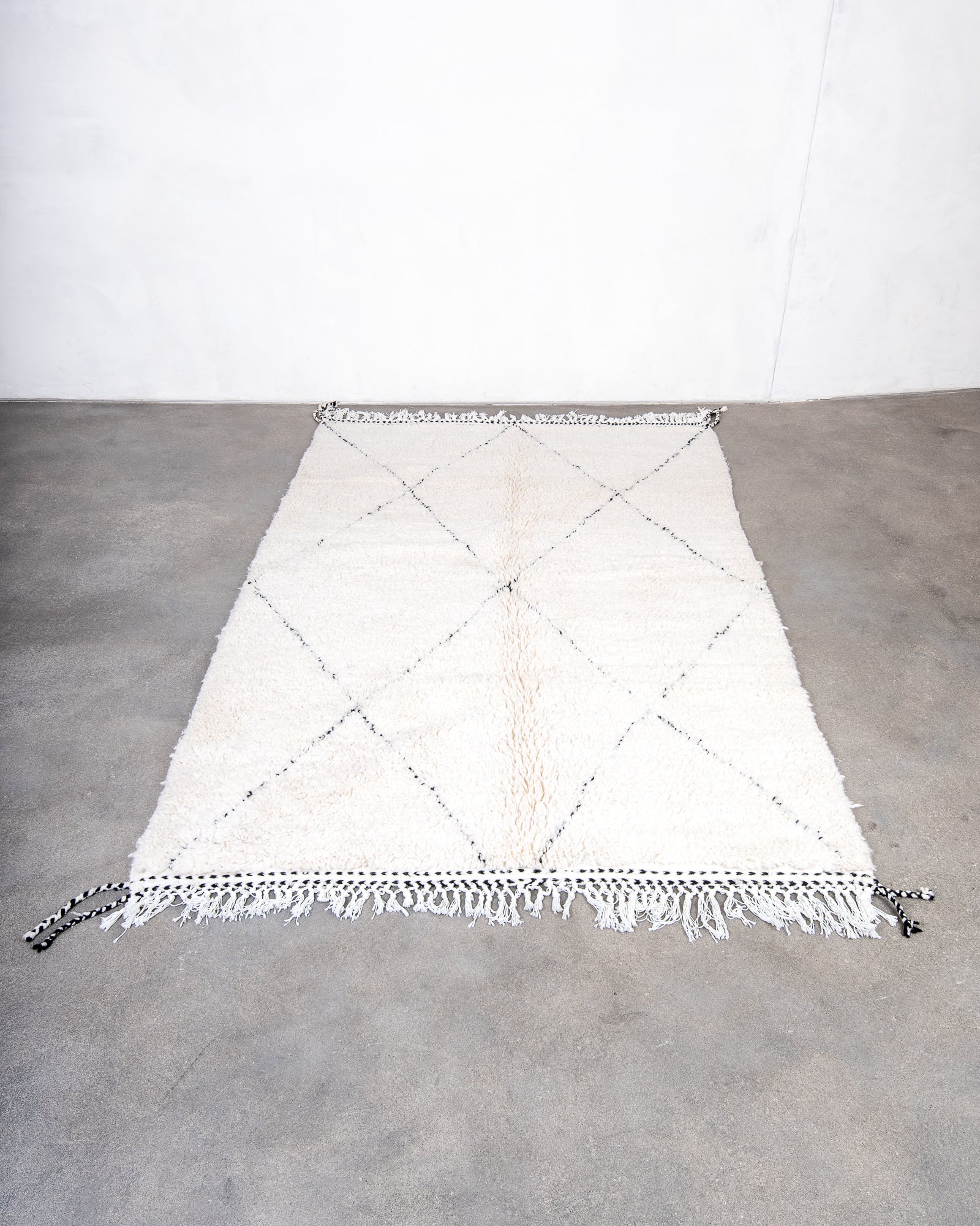 Modern, designer, handcrafted Berber rug from Morocco. Beniourain carpet with beautiful colours and patterns and fluffy wool texture.